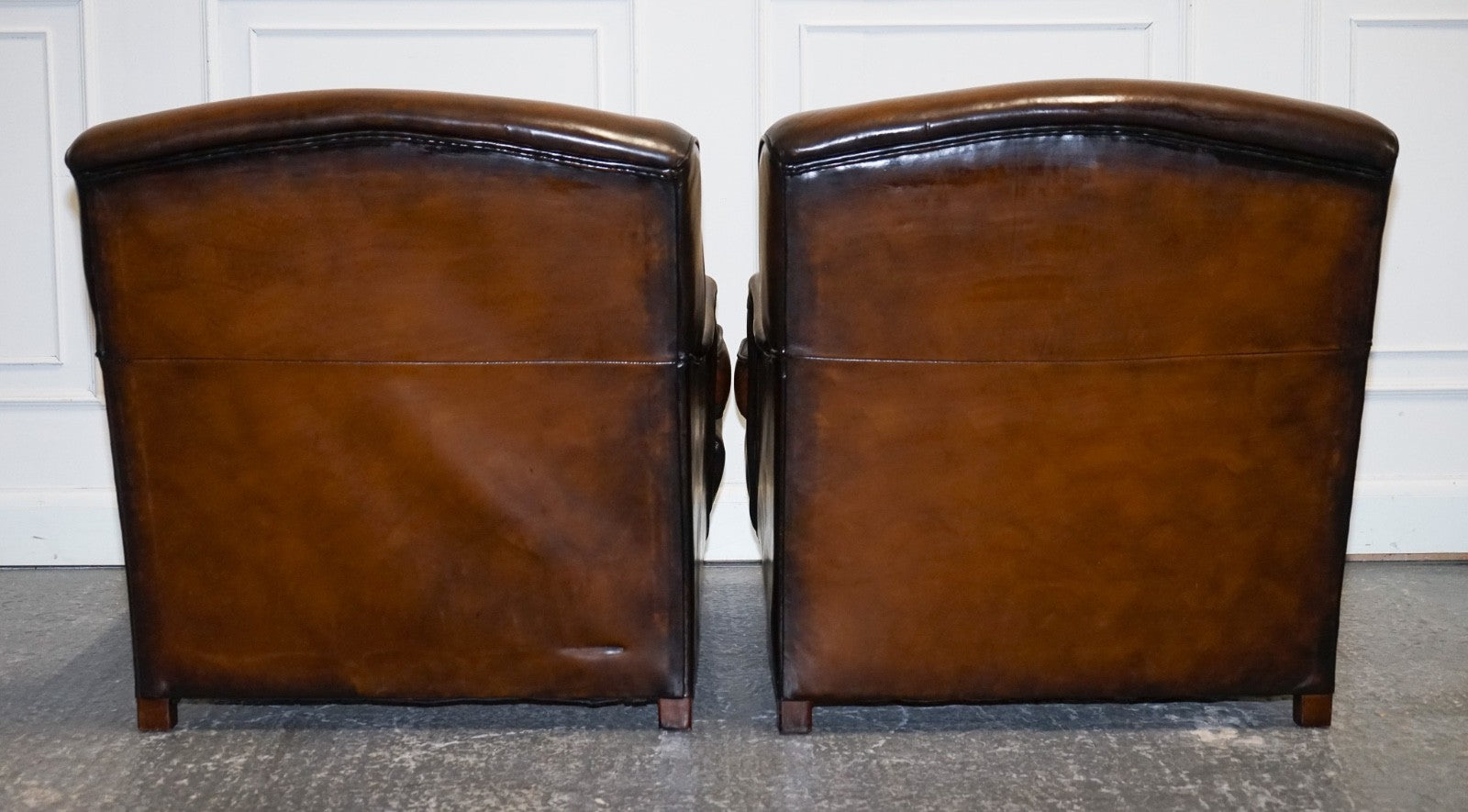 PAIR OF CIGAR HAND DYED LEATHER HOWARD & SONS STYLE ARMCHAIRS ON CASTOR FEET