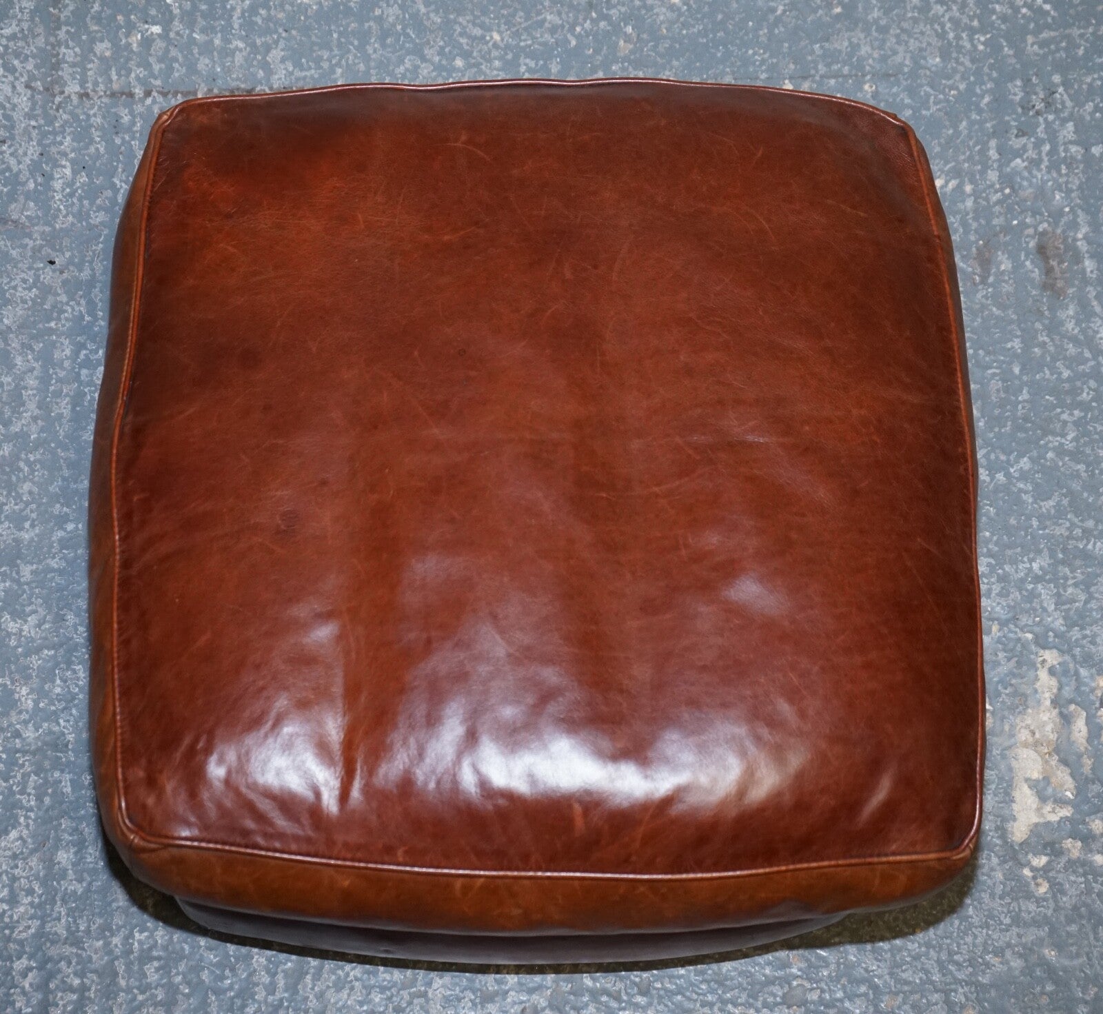 LOVELY VINTAGE BROWN LEATHER FOOTSTOOL FEATHER FILLED BRASS STUDS DETAIL