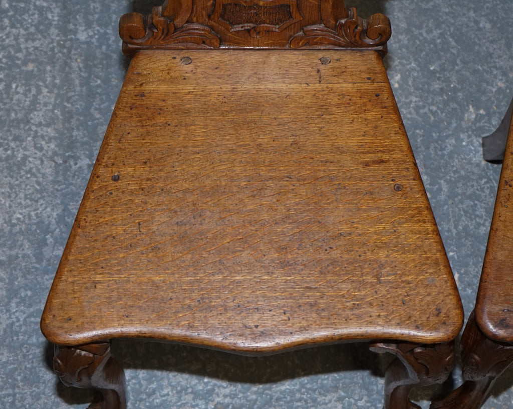 ANTIQUE PAIR OF VICTORIAN SOLID OAK CARVED HALLWAY CHAIRS WITH LION PAW FEET