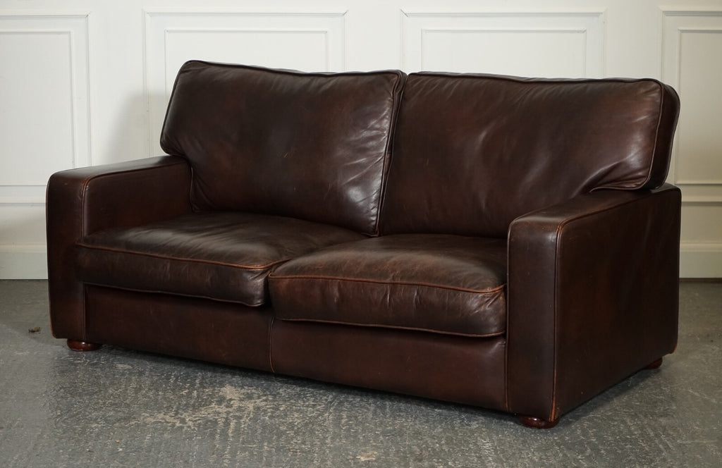 VINTAGE DISTRESSED BROWN LEATHER TWO TO THREE SEATER SOFA