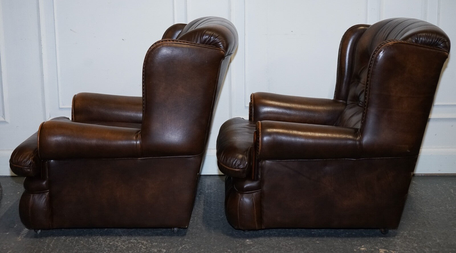 VINTAGE PAIR OF BRITISH MADE BROWN AGED LEATHER MONK CHESTERFIELD ARMCHAIRS