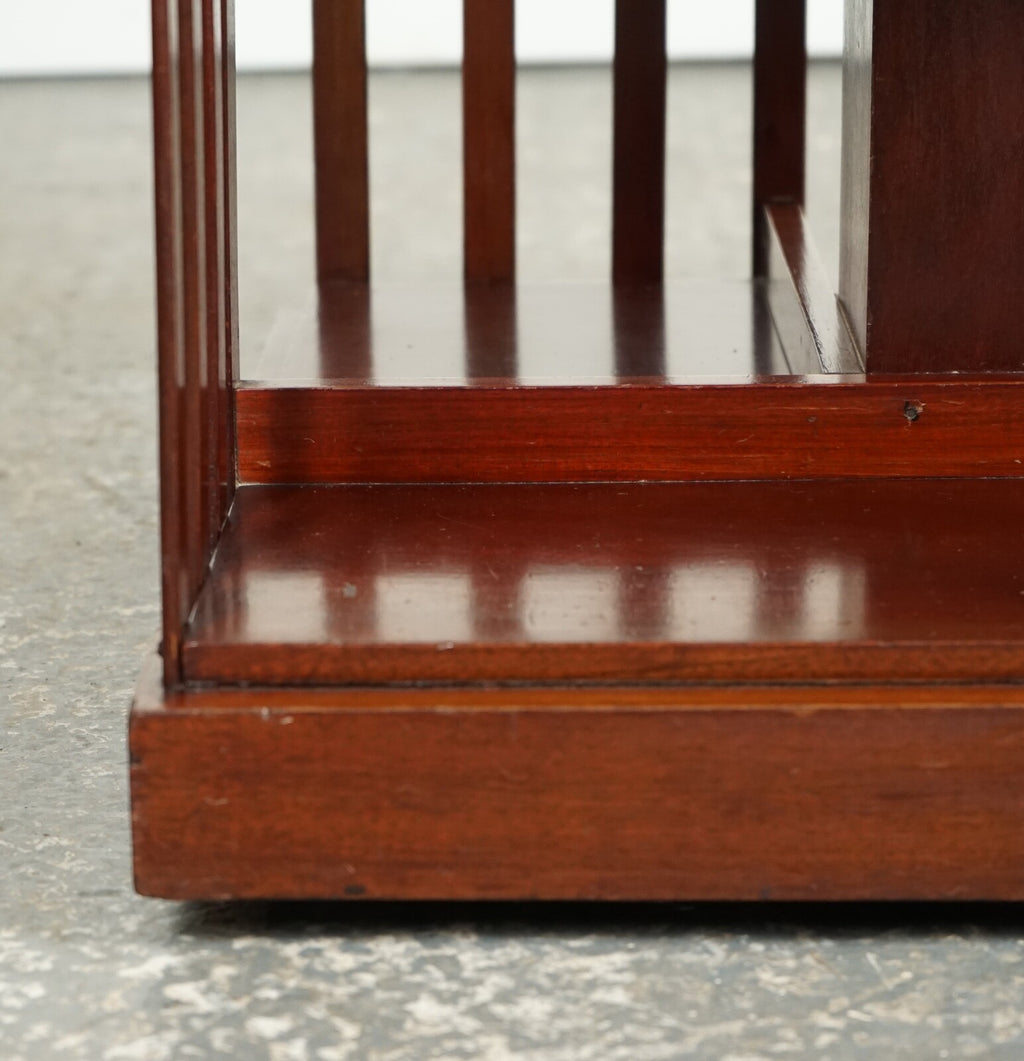 ANTIQUE EDWARDIAN REVOLVING BOOKCASE WITH A SERPENTINE SHAPED TOP