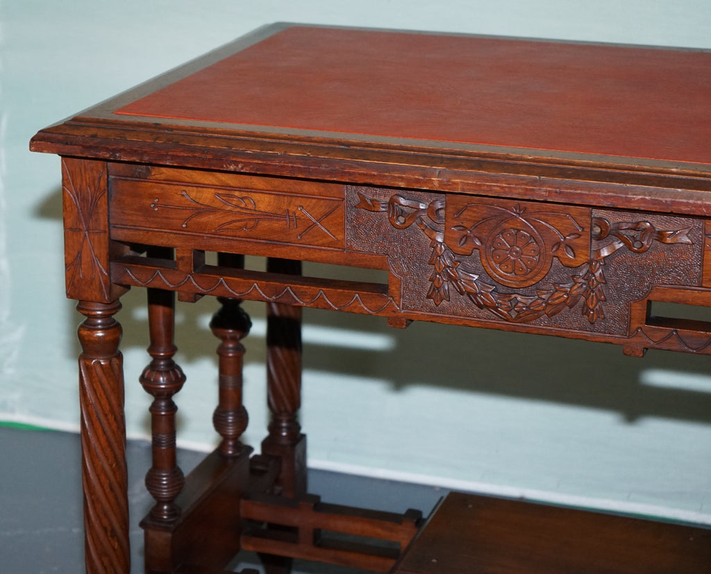 LATE 19TH CENTURY CONTINENTAL CARVED WALNUT WRITING TABLE LEATHER INLAY TOP