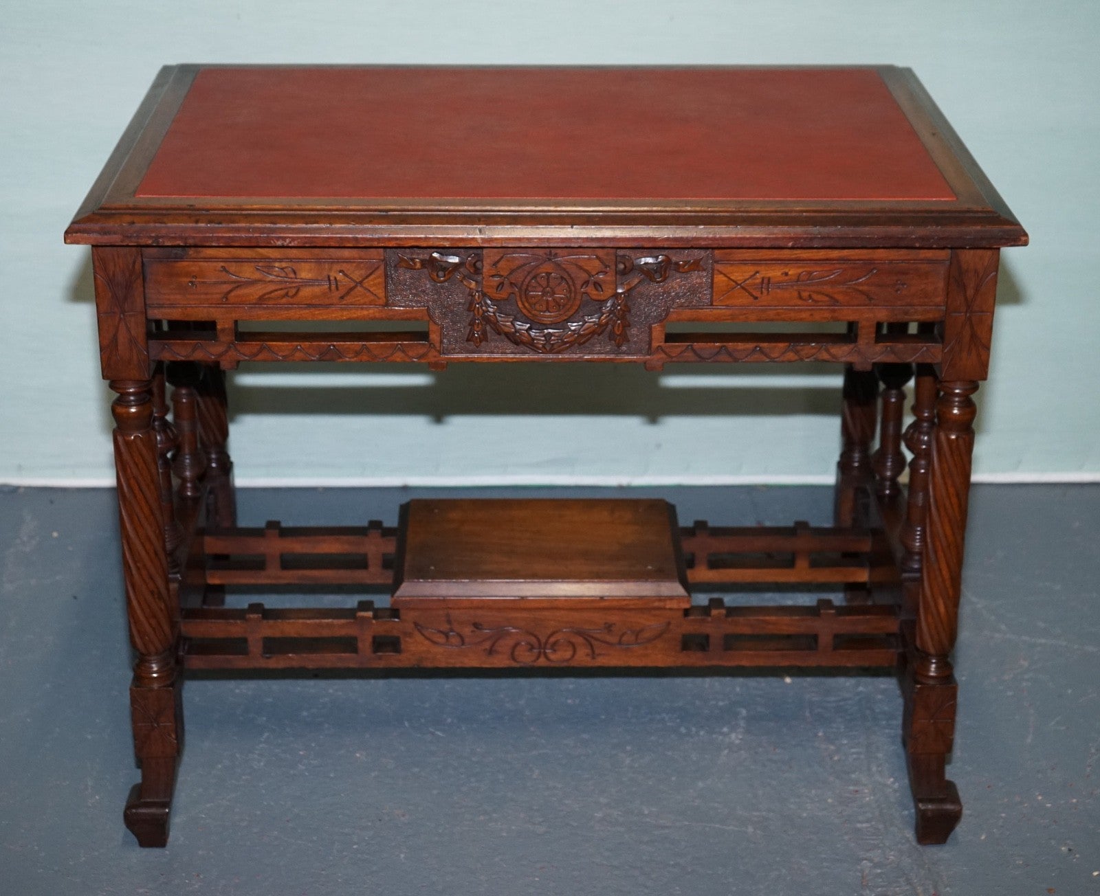 LATE 19TH CENTURY CONTINENTAL CARVED WALNUT WRITING TABLE LEATHER INLAY TOP