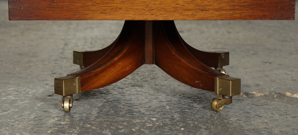 BEVAN FUNNEL REVOLVING BOOKCASE END TABLE RAISED ON BRASS CASTORS