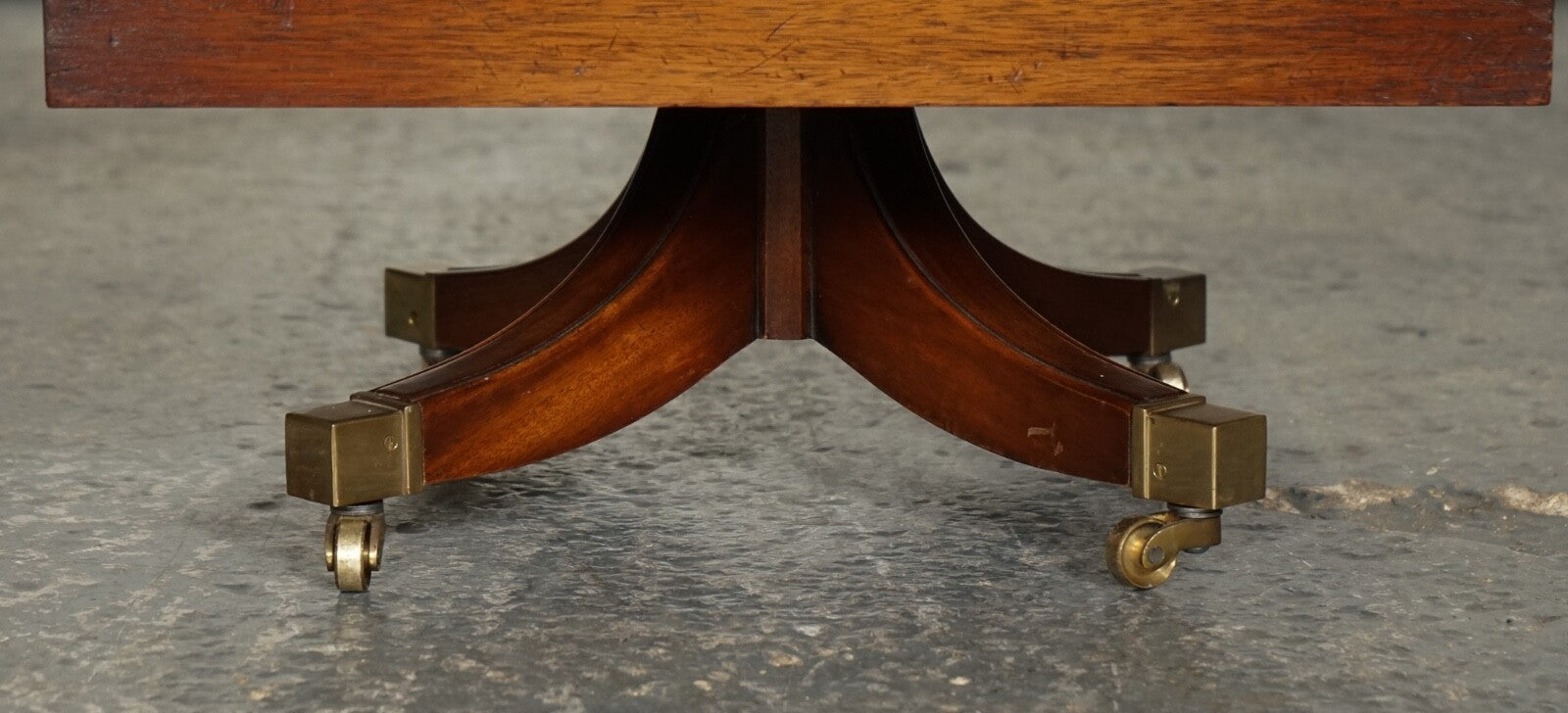 BEVAN FUNNEL REVOLVING BOOKCASE END TABLE RAISED ON BRASS CASTORS