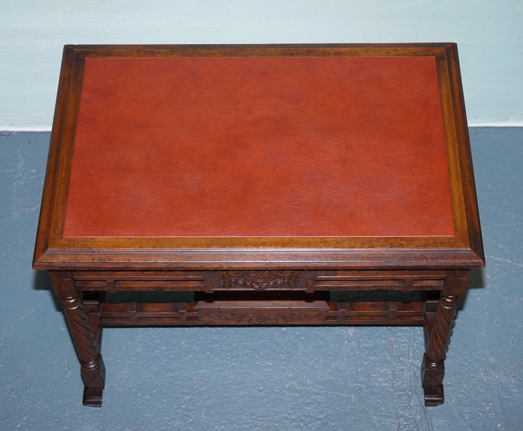 LATE 19TH CENTURY CONTINENTAL CARVED WALNUT WRITING TABLE LEATHER INLAY TOP