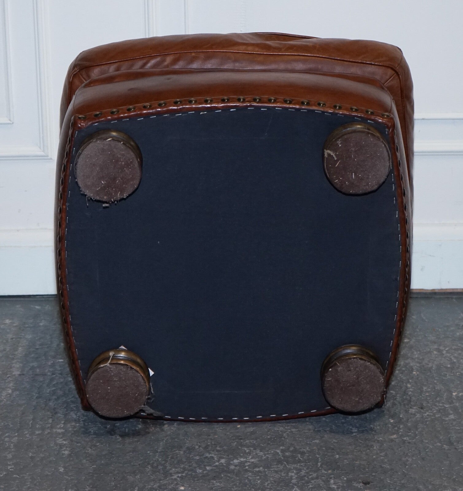 LOVELY VINTAGE BROWN LEATHER FOOTSTOOL FEATHER FILLED BRASS STUDS DETAIL