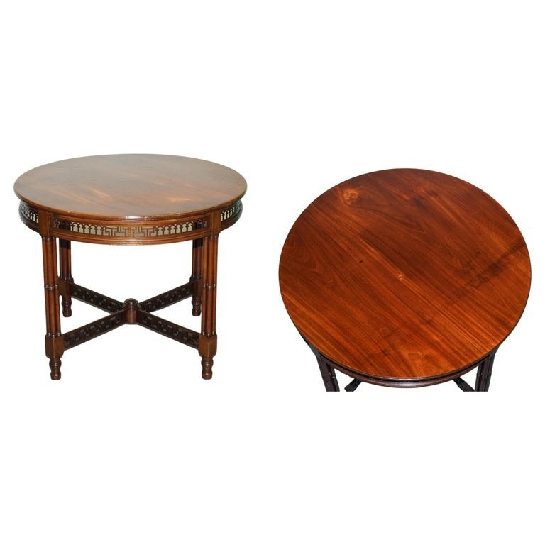 LATE 19TH CENTURY CHIPPENDALE STYLE ROUND OCCASIONAL TABLE AND CARVED STRETCHERS