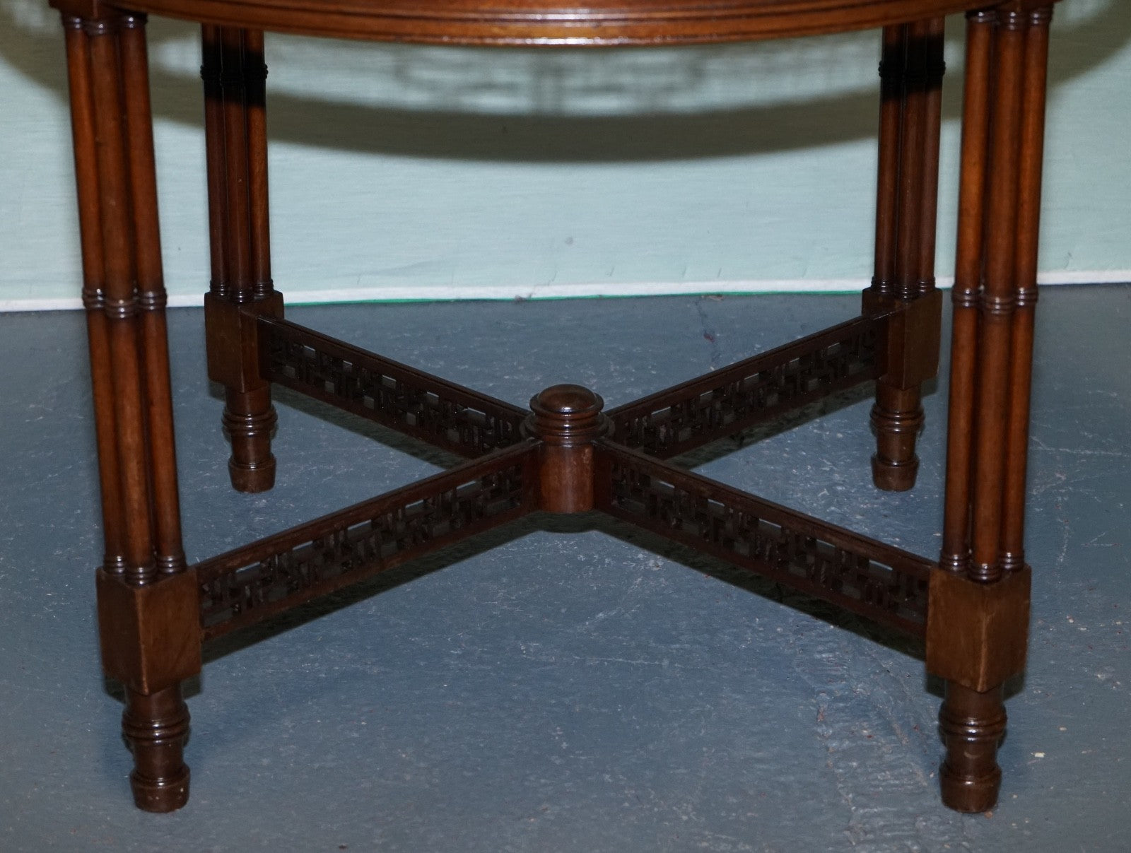 LATE 19TH CENTURY CHIPPENDALE STYLE ROUND OCCASIONAL TABLE AND CARVED STRETCHERS