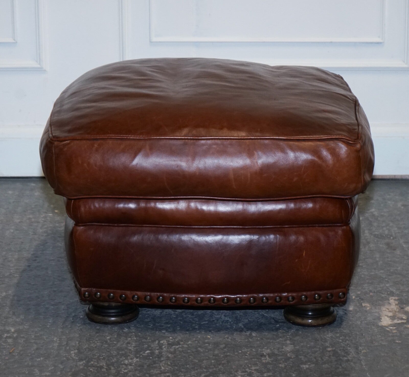 LOVELY VINTAGE BROWN LEATHER FOOTSTOOL FEATHER FILLED BRASS STUDS DETAIL