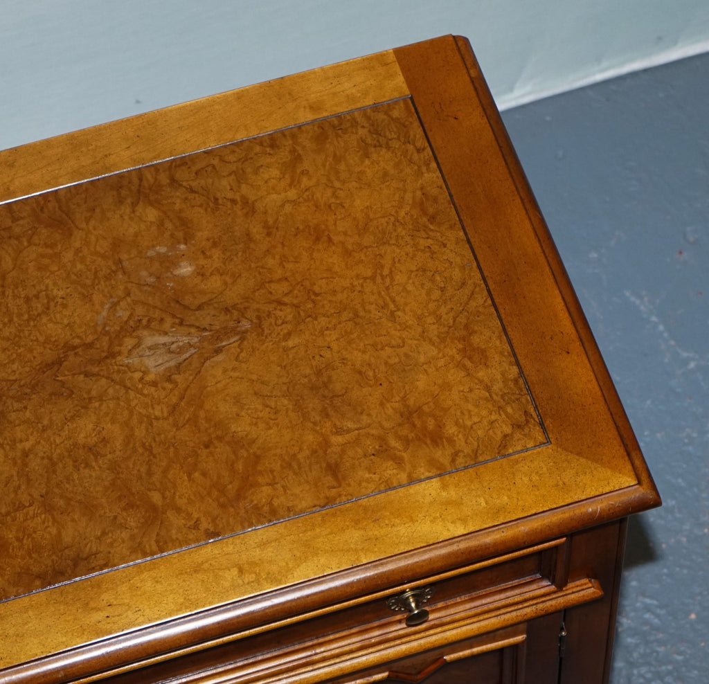 BAKER FURNITURE BURR WALNUT BEDSIDE CABINET WITH DRAWER AND CARVED DOORS