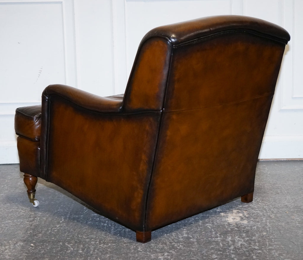 PAIR OF CIGAR HAND DYED LEATHER HOWARD & SONS STYLE ARMCHAIRS ON CASTOR FEET