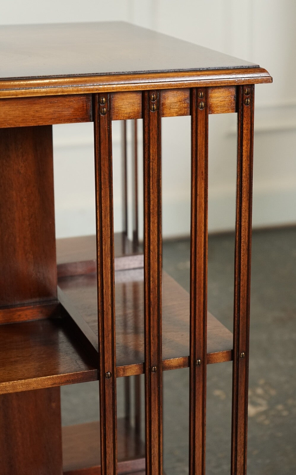 BEVAN FUNNEL REVOLVING BOOKCASE END TABLE RAISED ON BRASS CASTORS