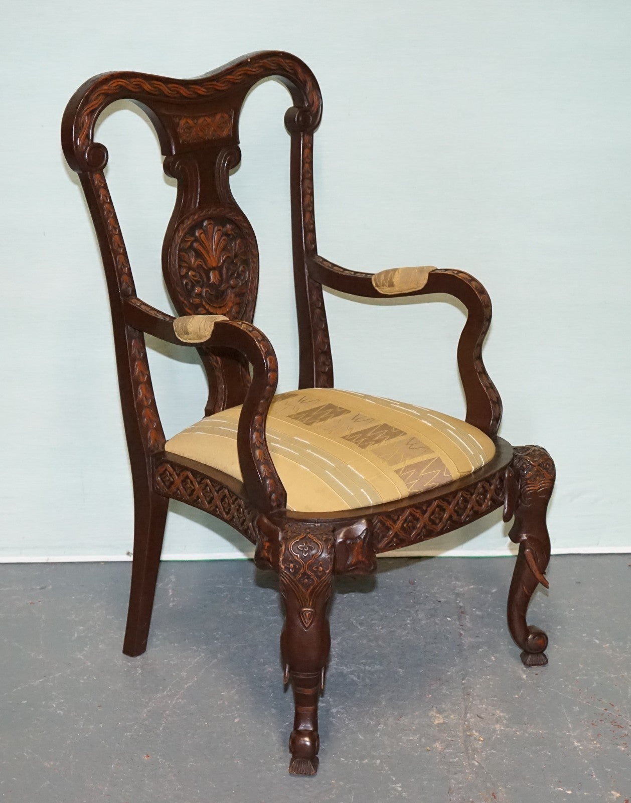 ANGLO INDIAN WOODEN HEAVILY CARVED ELEPHANT DETAIL SINGLE CAVER ARMCHAIR