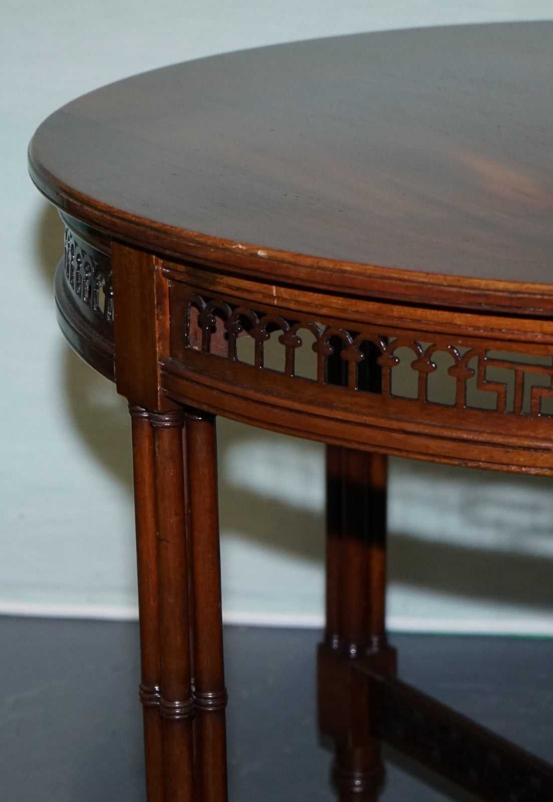 LATE 19TH CENTURY CHIPPENDALE STYLE ROUND OCCASIONAL TABLE AND CARVED STRETCHERS