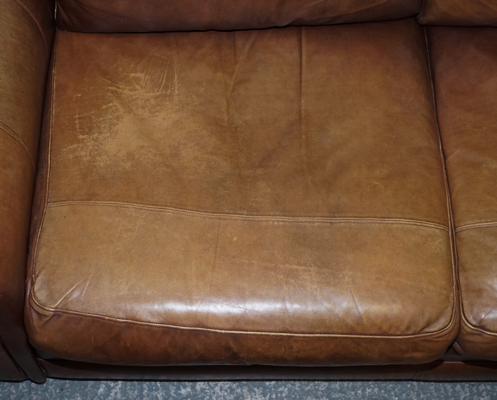 COMFORTABLE BROWN LEATHER TWO TO THREE SEATER SOFA WITH FEATHER BACK CUSHIONS