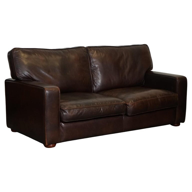 VINTAGE DISTRESSED BROWN LEATHER TWO TO THREE SEATER SOFA