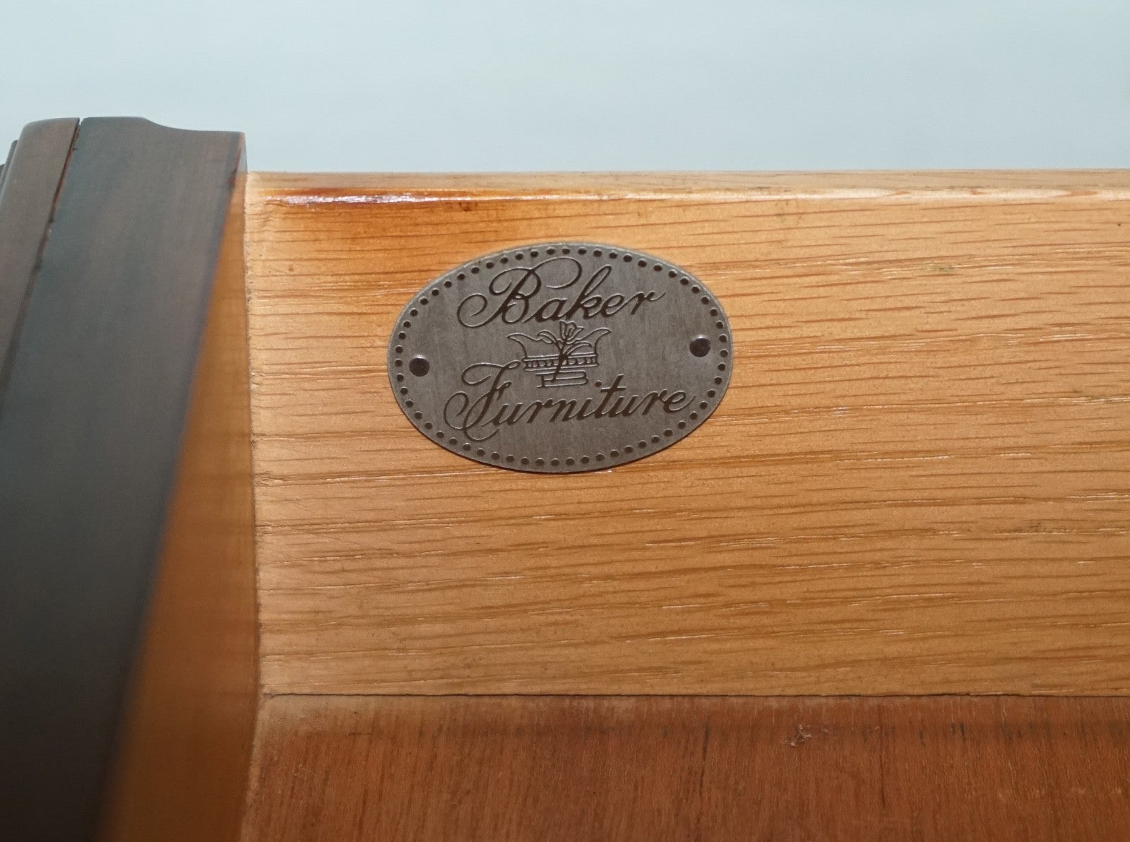 BAKER FURNITURE BURR WALNUT BEDSIDE CABINET WITH DRAWER AND CARVED DOORS