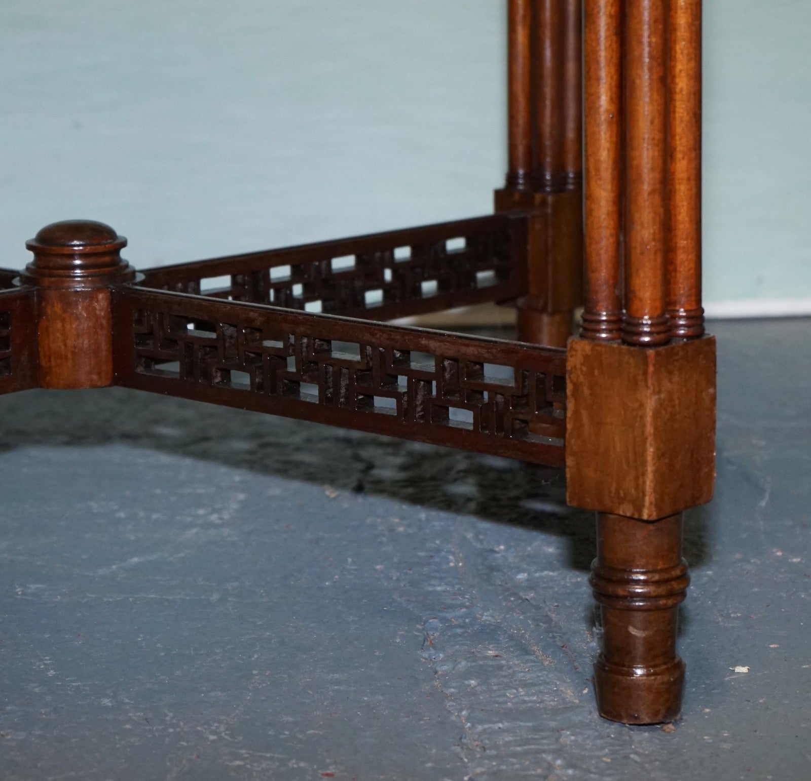 LATE 19TH CENTURY CHIPPENDALE STYLE ROUND OCCASIONAL TABLE AND CARVED STRETCHERS