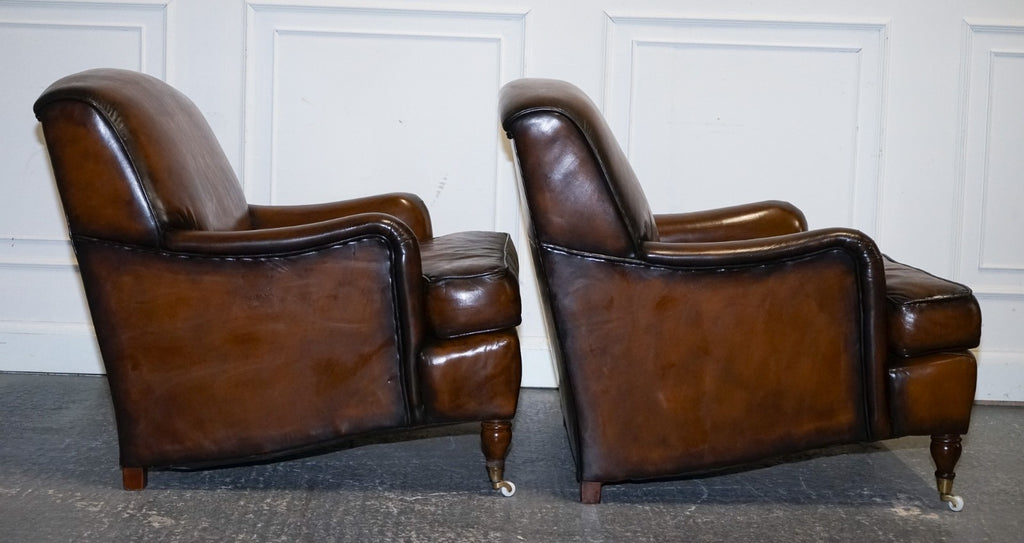 PAIR OF CIGAR HAND DYED LEATHER HOWARD & SONS STYLE ARMCHAIRS ON CASTOR FEET