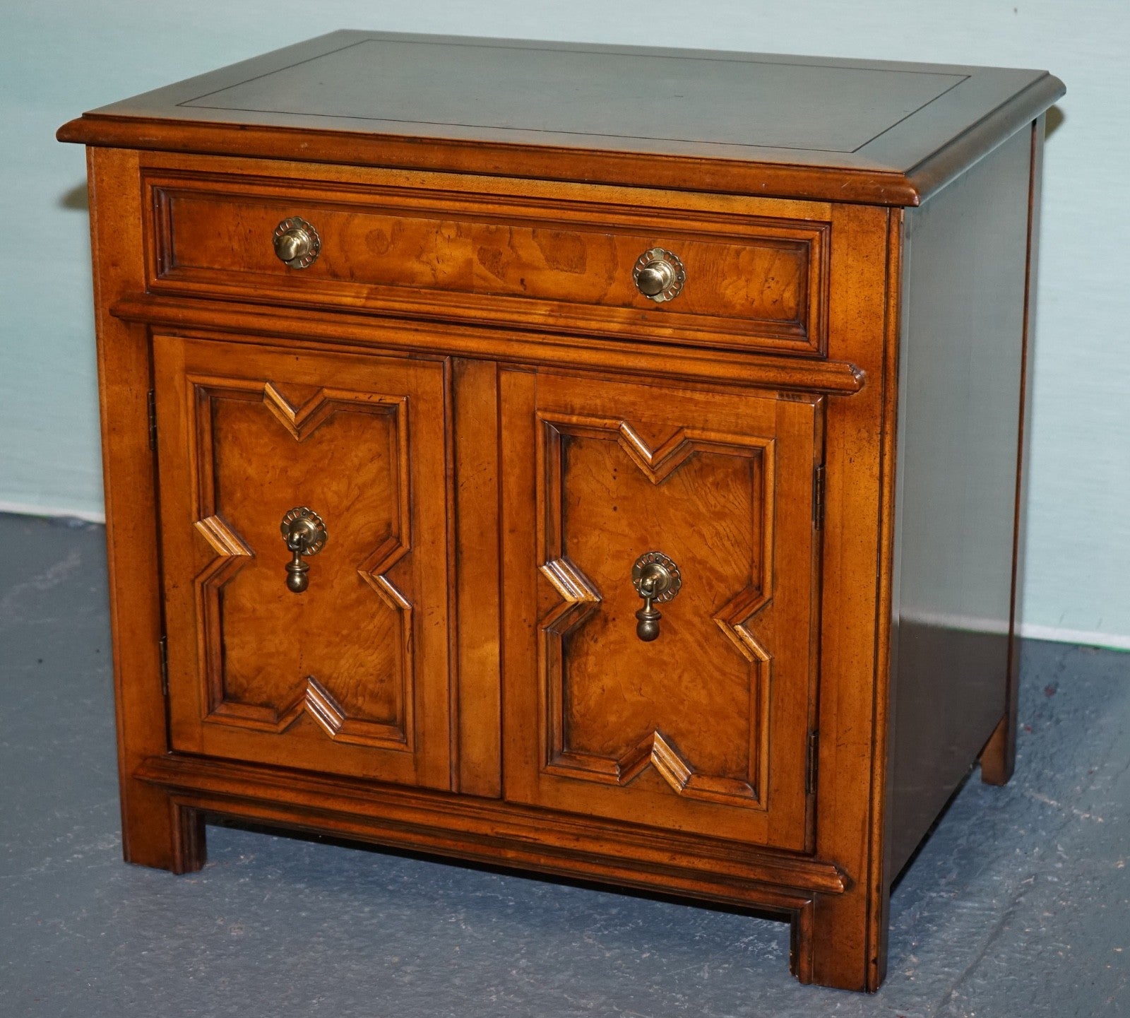 BAKER FURNITURE BURR WALNUT BEDSIDE CABINET WITH DRAWER AND CARVED DOORS