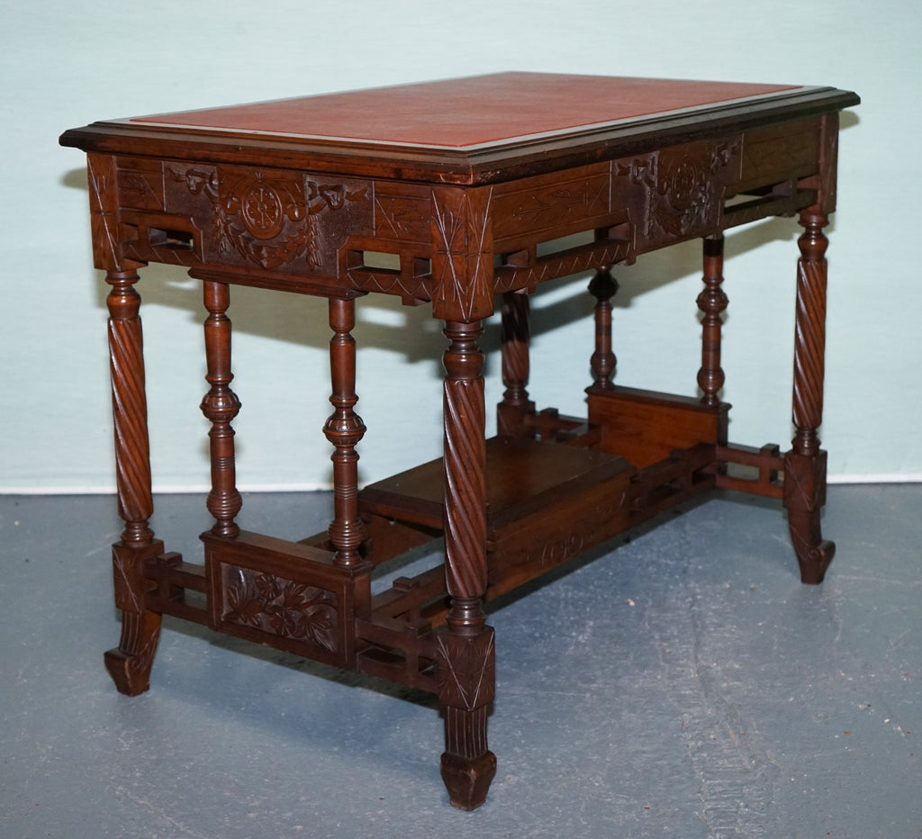 LATE 19TH CENTURY CONTINENTAL CARVED WALNUT WRITING TABLE LEATHER INLAY TOP