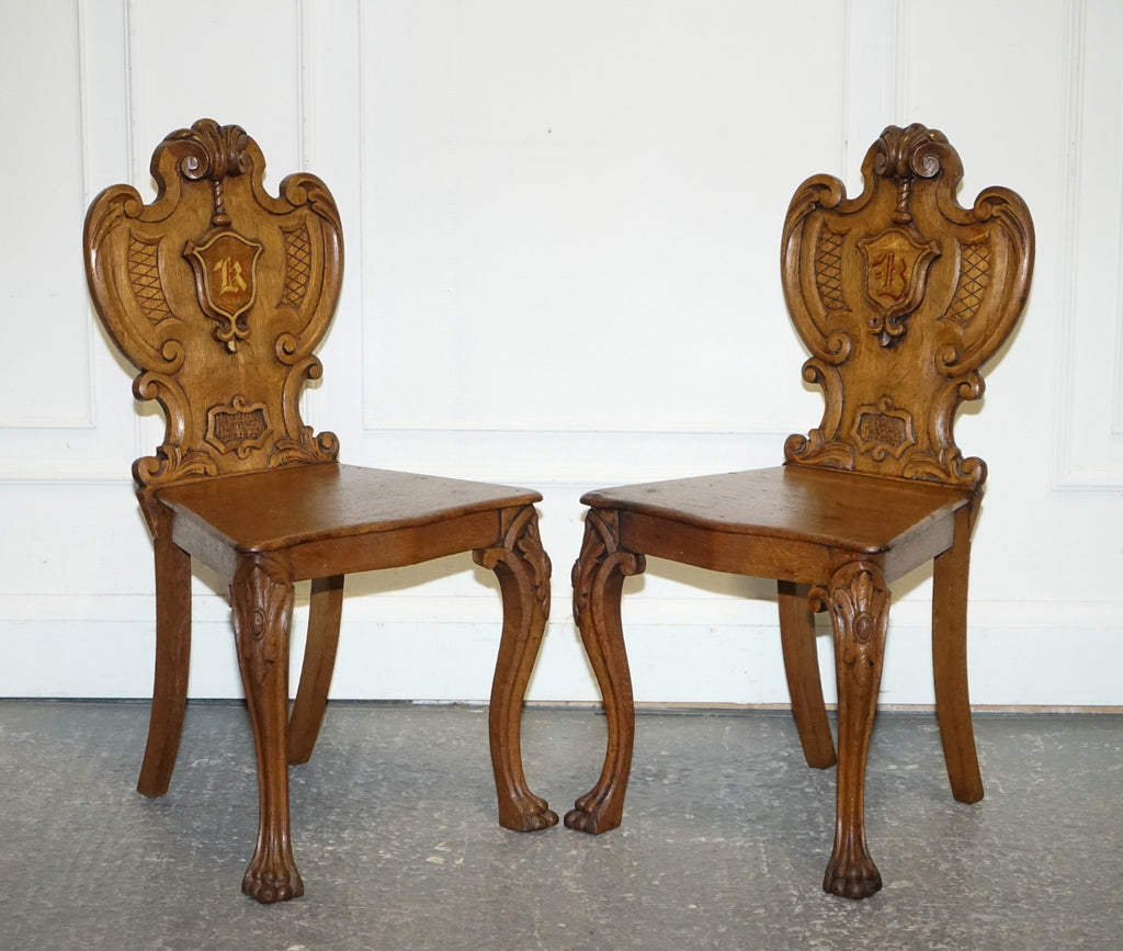 ANTIQUE PAIR OF VICTORIAN SOLID OAK CARVED HALLWAY CHAIRS WITH LION PAW FEET