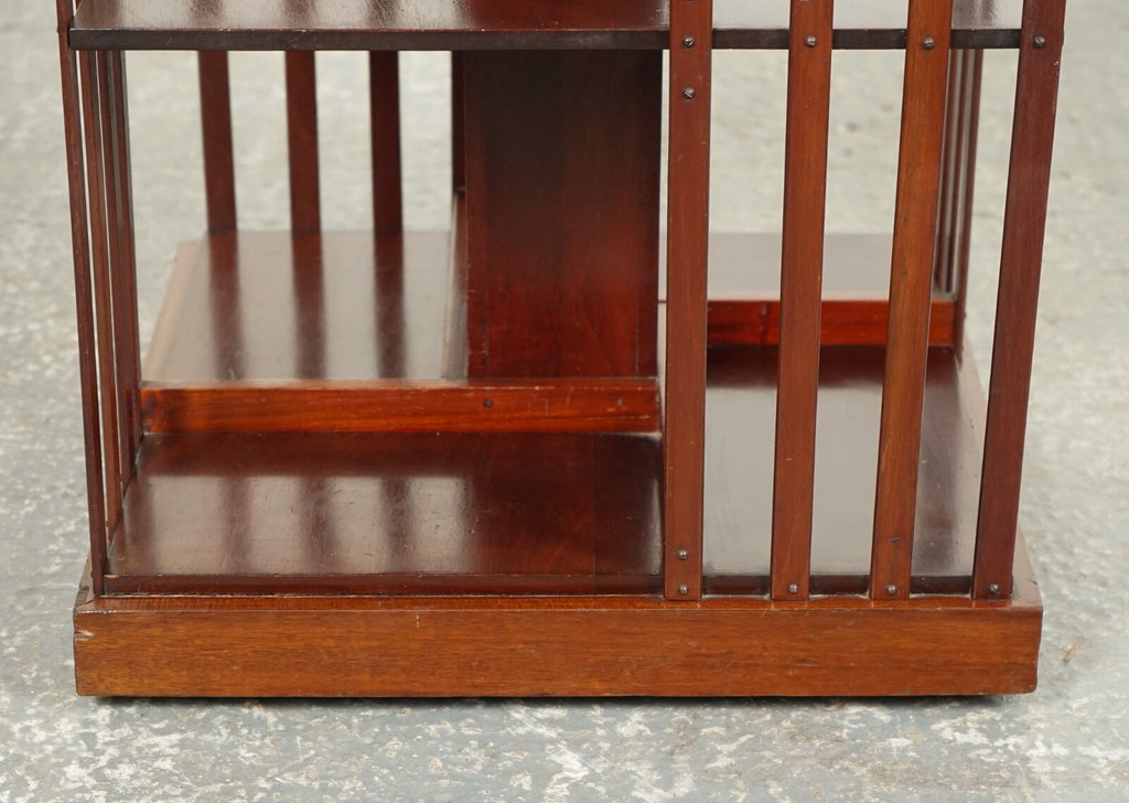 ANTIQUE EDWARDIAN REVOLVING BOOKCASE WITH A SERPENTINE SHAPED TOP