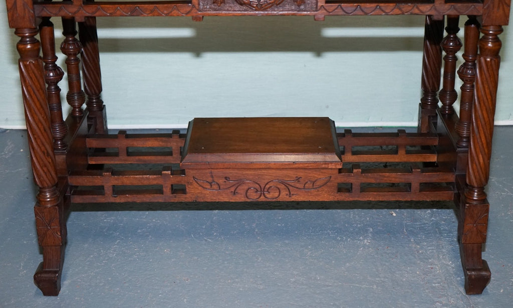 LATE 19TH CENTURY CONTINENTAL CARVED WALNUT WRITING TABLE LEATHER INLAY TOP