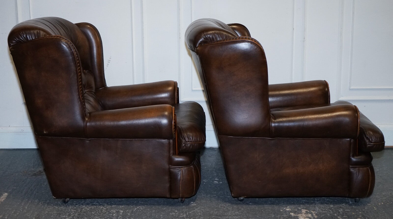 VINTAGE PAIR OF BRITISH MADE BROWN AGED LEATHER MONK CHESTERFIELD ARMCHAIRS