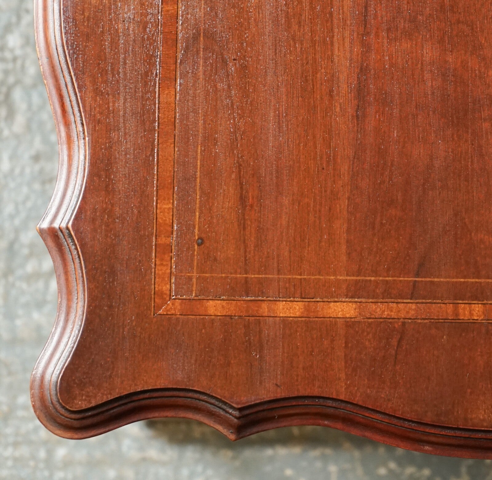 ANTIQUE EDWARDIAN REVOLVING BOOKCASE WITH A SERPENTINE SHAPED TOP