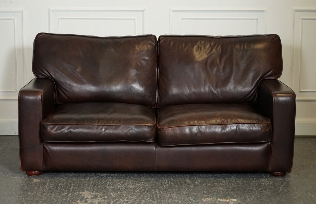 VINTAGE DISTRESSED BROWN LEATHER TWO TO THREE SEATER SOFA