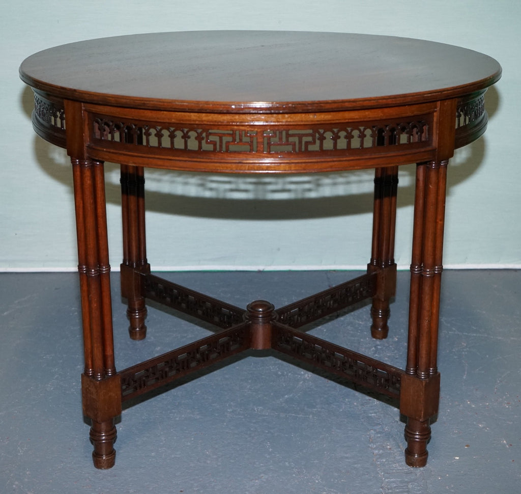 LATE 19TH CENTURY CHIPPENDALE STYLE ROUND OCCASIONAL TABLE AND CARVED STRETCHERS