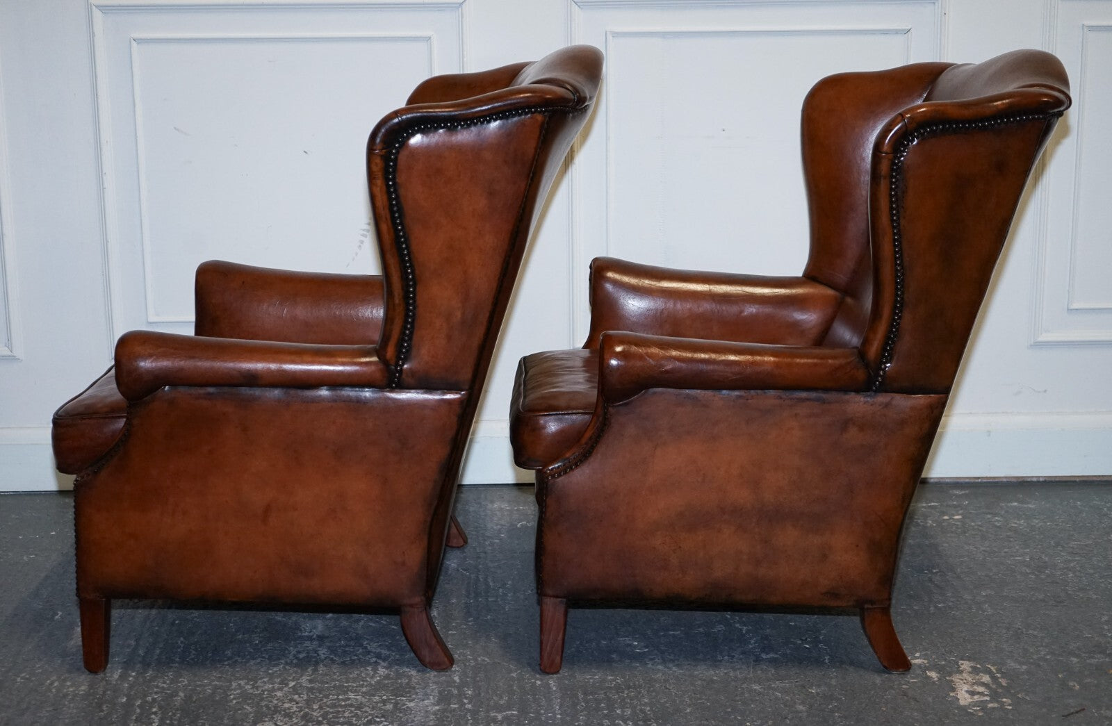 ANTIQUE PAIR OF DUTCH HAND DYED BROWN CATTLE LEATHER WINGBACK ARMCHAIRS