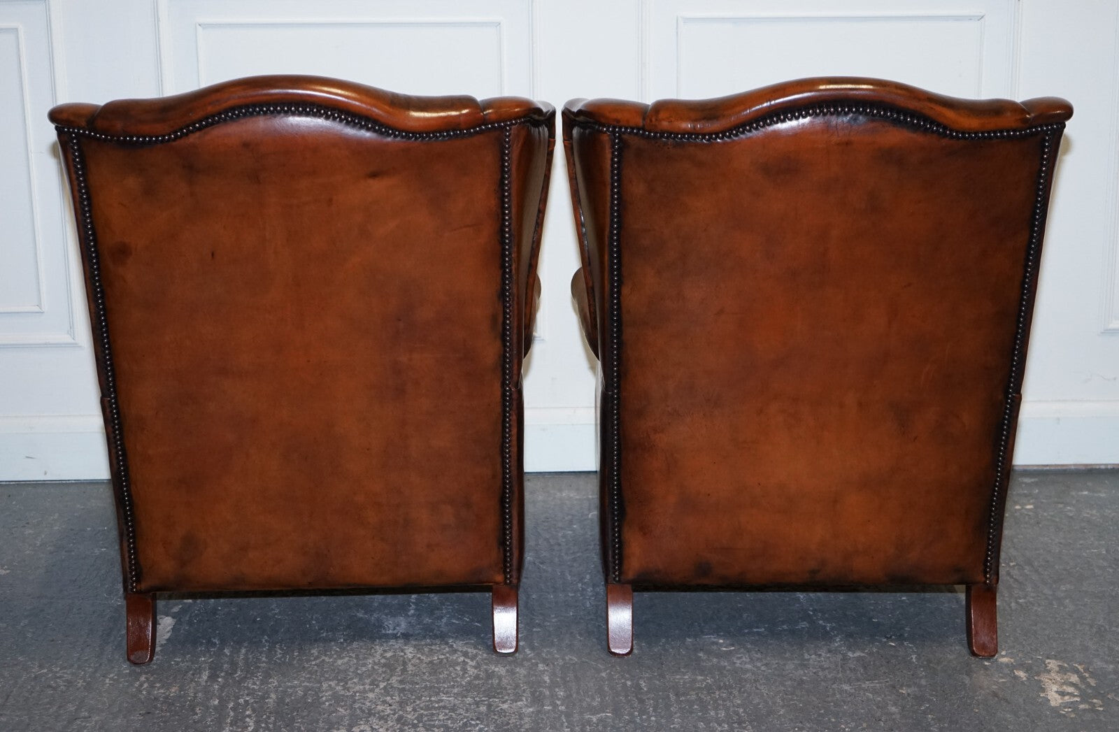 ANTIQUE PAIR OF DUTCH HAND DYED BROWN CATTLE LEATHER WINGBACK ARMCHAIRS