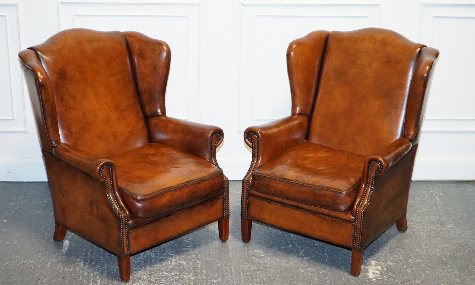 ANTIQUE PAIR OF DUTCH HAND DYED BROWN CATTLE LEATHER WINGBACK ARMCHAIRS