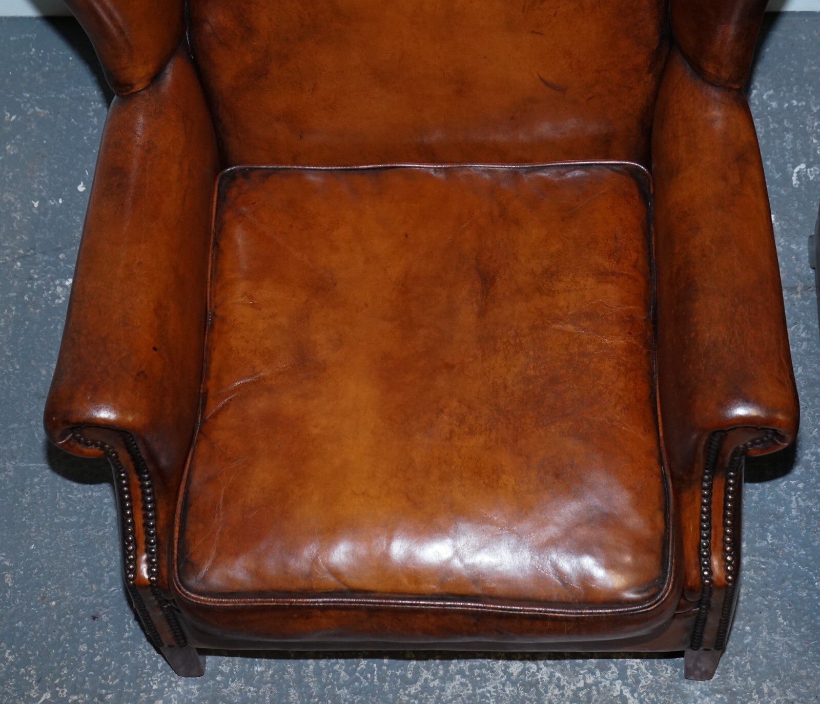 ANTIQUE PAIR OF DUTCH HAND DYED BROWN CATTLE LEATHER WINGBACK ARMCHAIRS