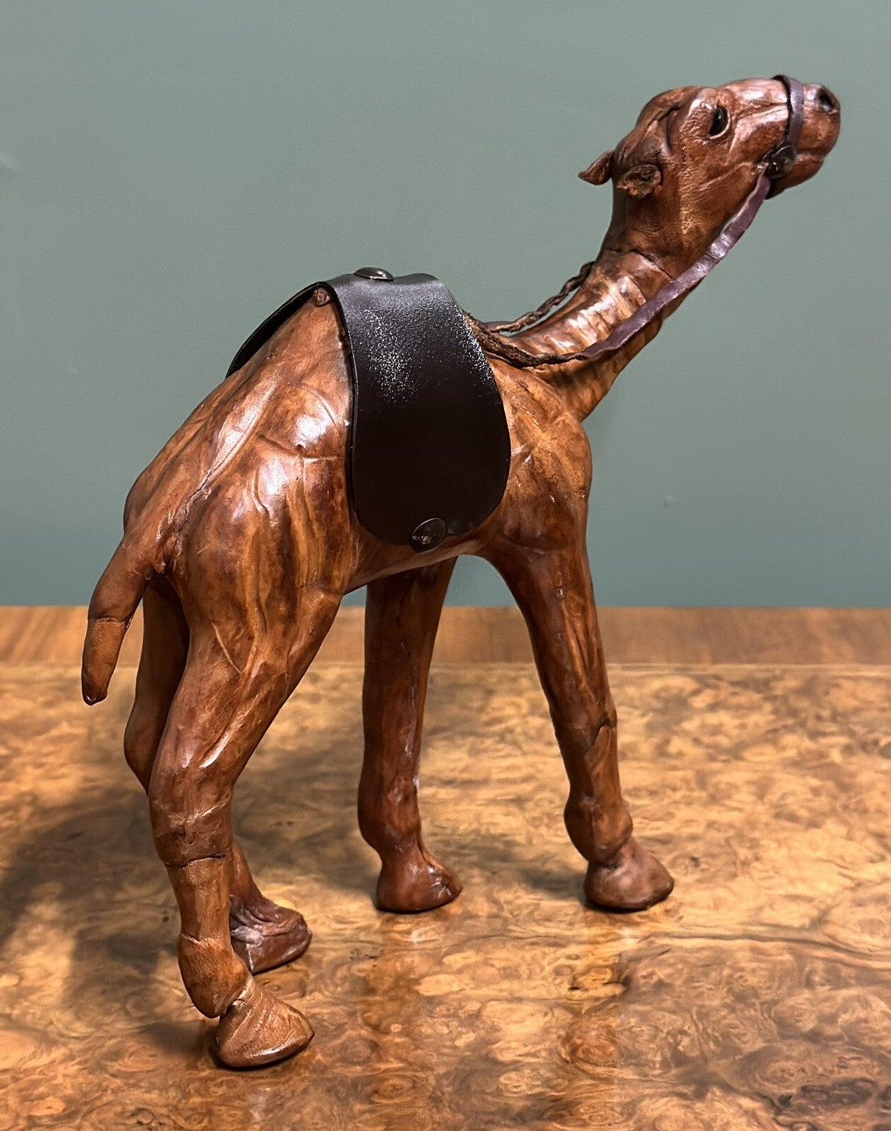 CAMEL SCULPTURE WITH LOVELY AGED LEATHER ON HAND CARVED WOOD BY LIBERTYS LONDON