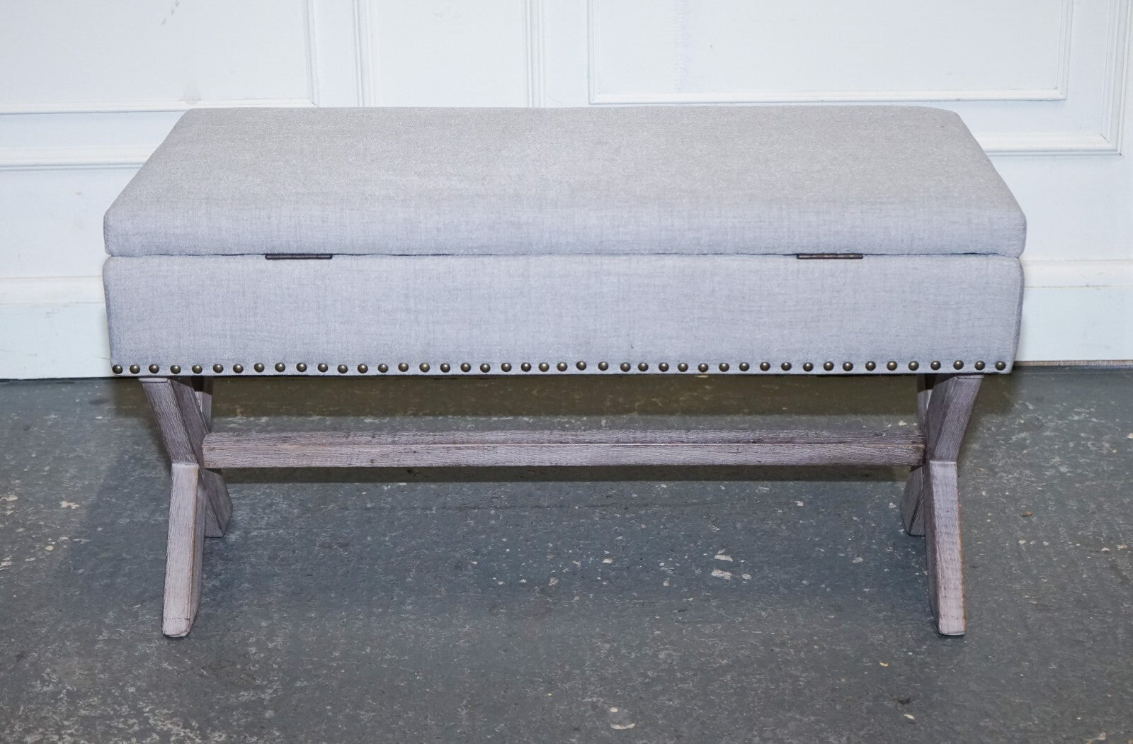 LOVELY VINTAGE GREY TAUPE FABRIC OTTOMAN WITH STORAGE SPACE RAISED ON X FRAME