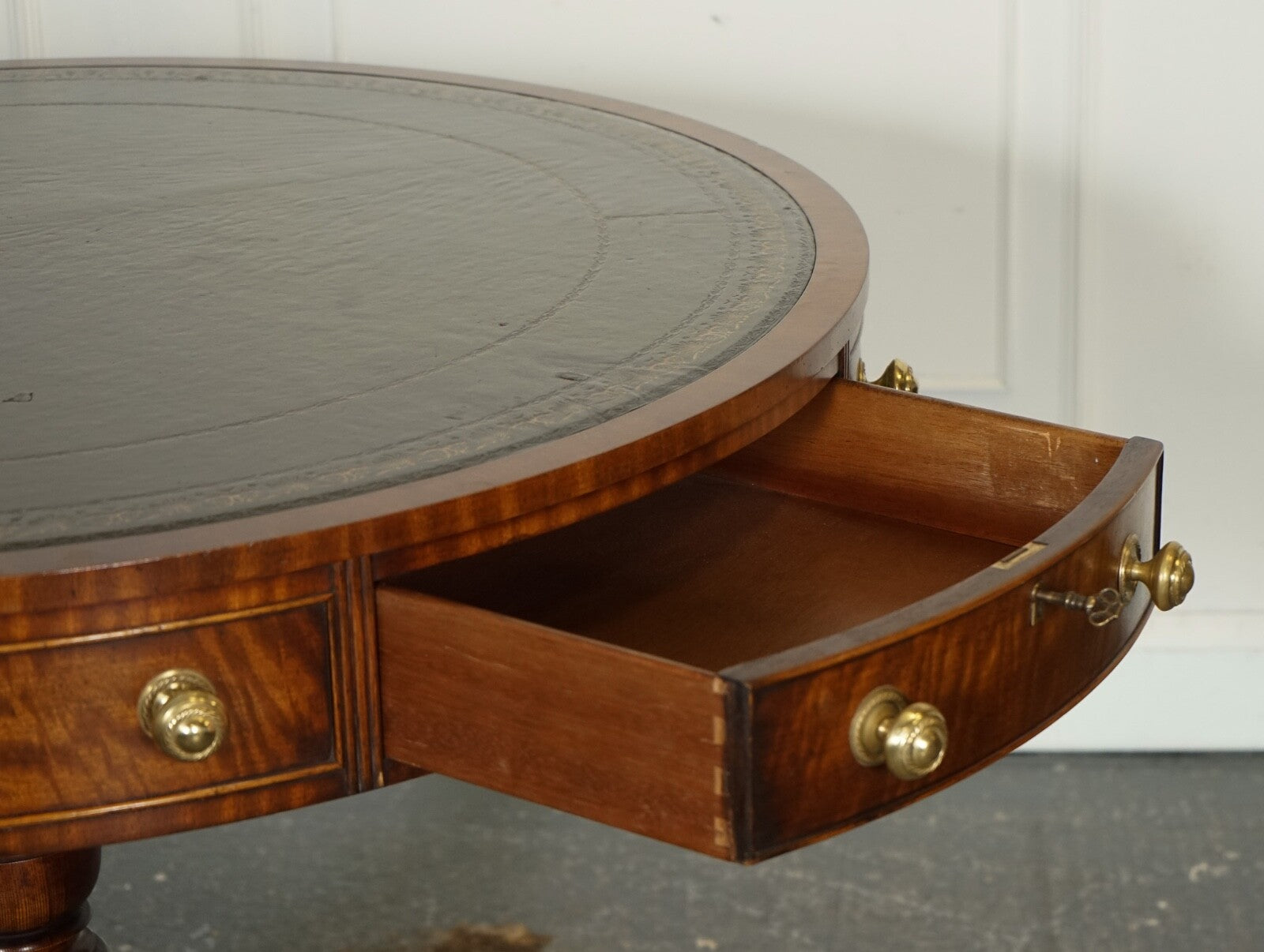 FINE RESTORED REGENCY STYLE DRUM TOP LIBRARY TABLE WITH AGED GREEN LEATHER TOP