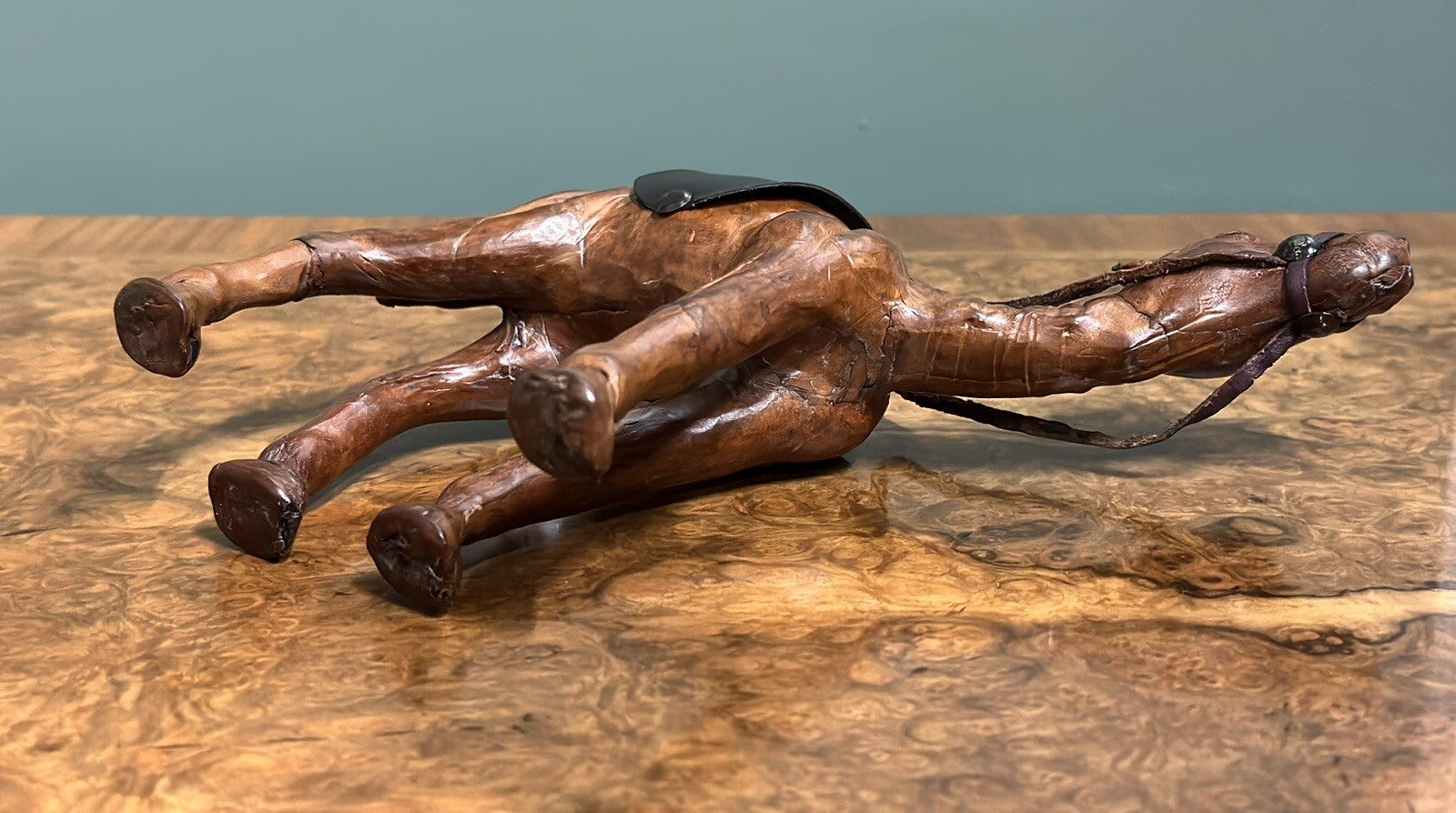 CAMEL SCULPTURE WITH LOVELY AGED LEATHER ON HAND CARVED WOOD BY LIBERTYS LONDON
