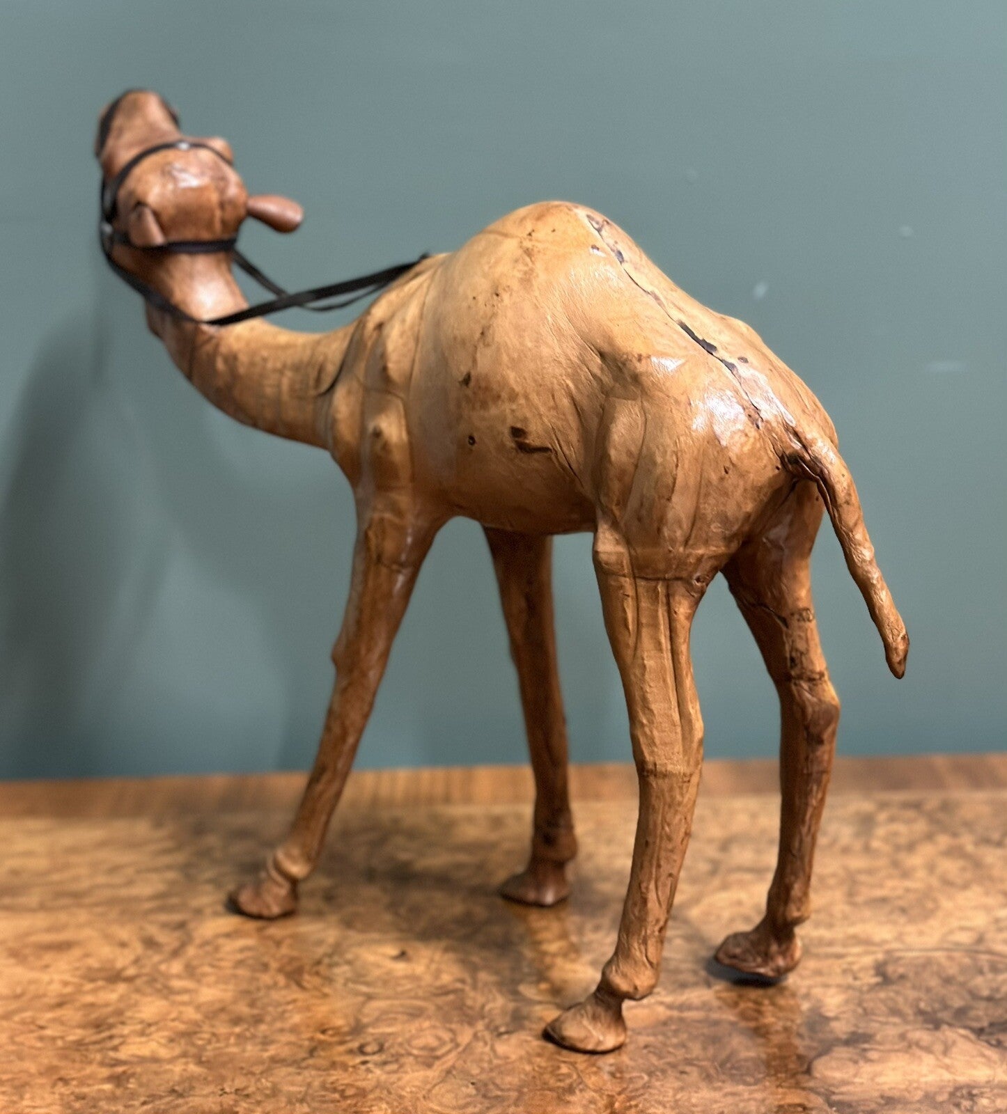LiBERTY'S LONDON CAMEL SCULPTURE WITH LOVELY AGED LEATHER ON HAND CARVED WOOD