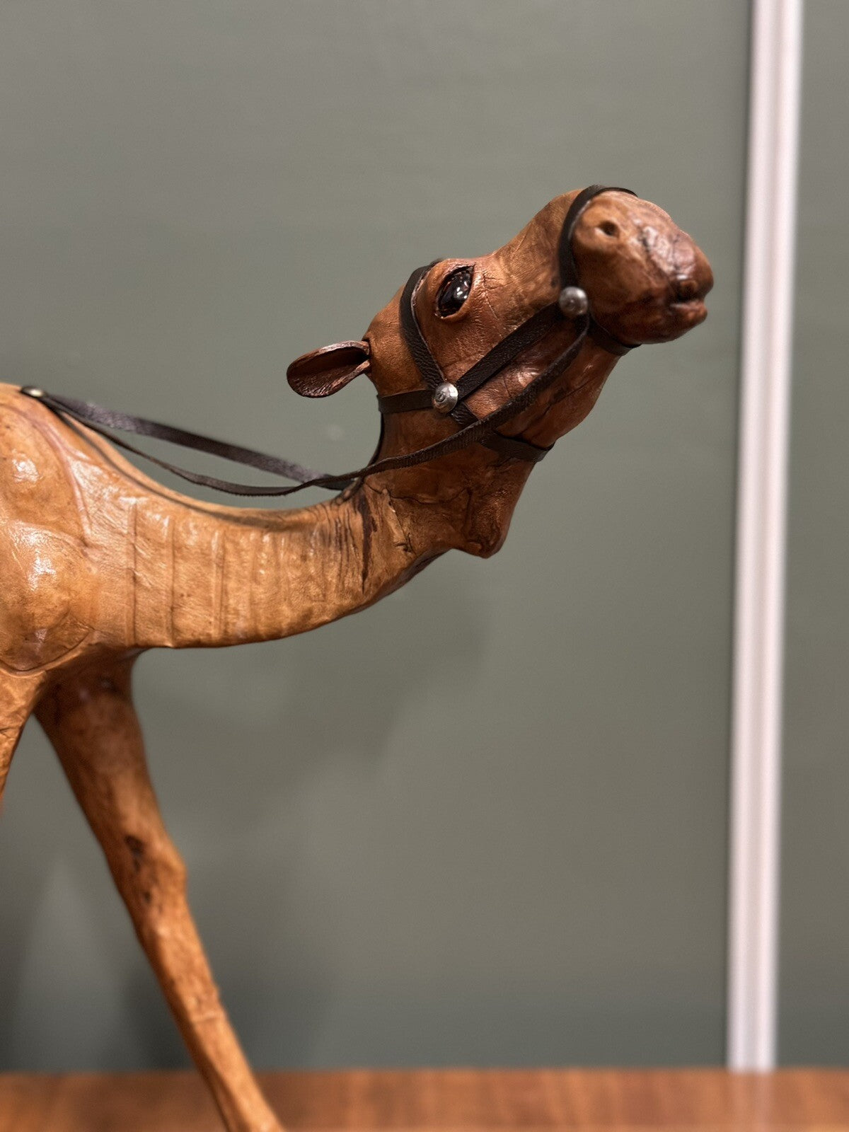 LiBERTY'S LONDON CAMEL SCULPTURE WITH LOVELY AGED LEATHER ON HAND CARVED WOOD