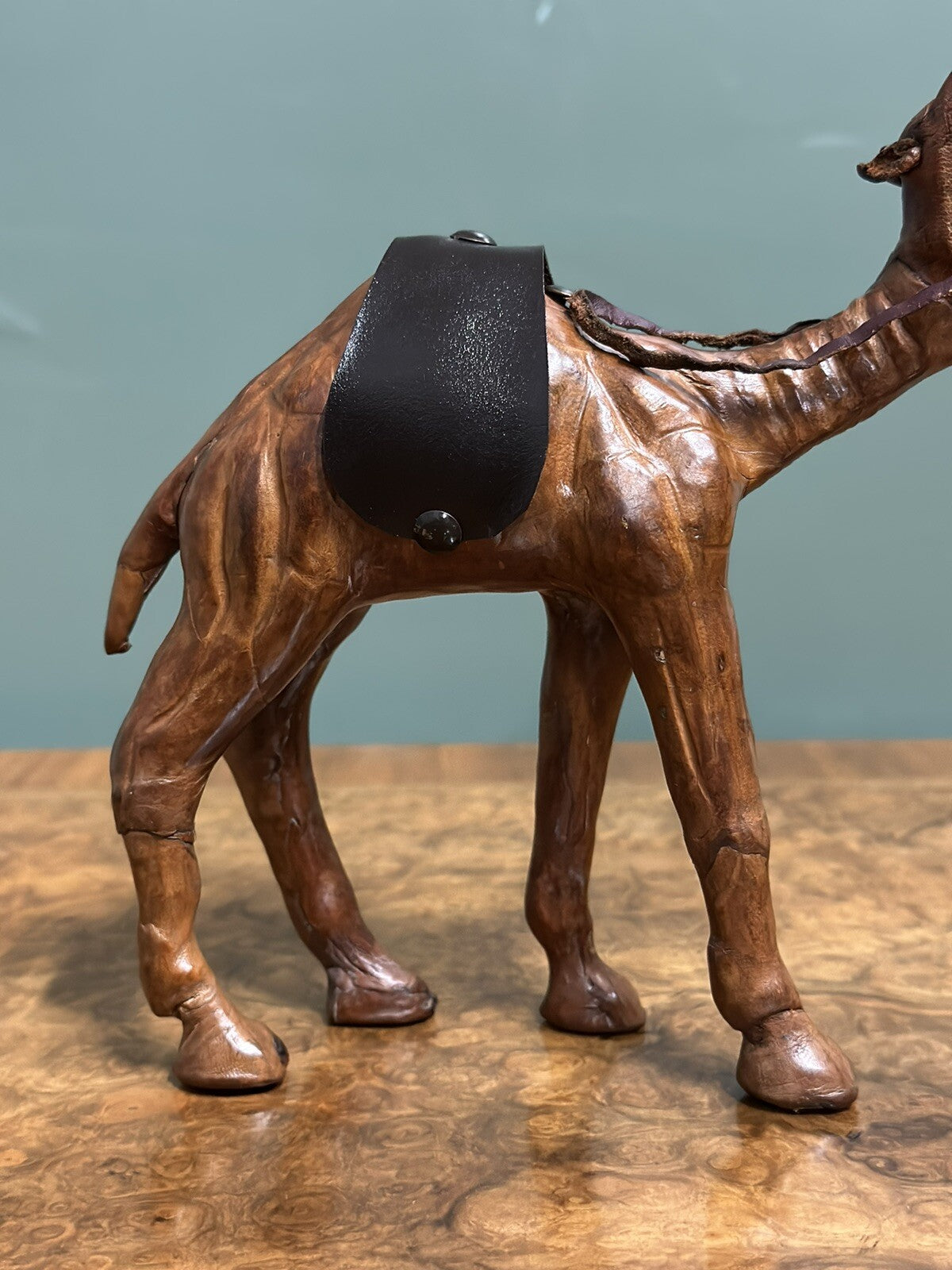 CAMEL SCULPTURE WITH LOVELY AGED LEATHER ON HAND CARVED WOOD BY LIBERTYS LONDON