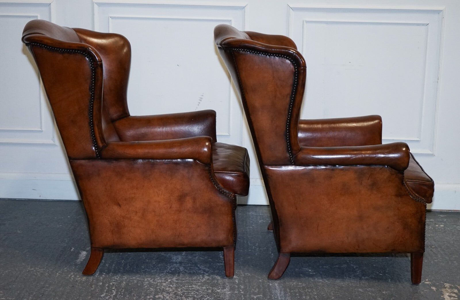 ANTIQUE PAIR OF DUTCH HAND DYED BROWN CATTLE LEATHER WINGBACK ARMCHAIRS