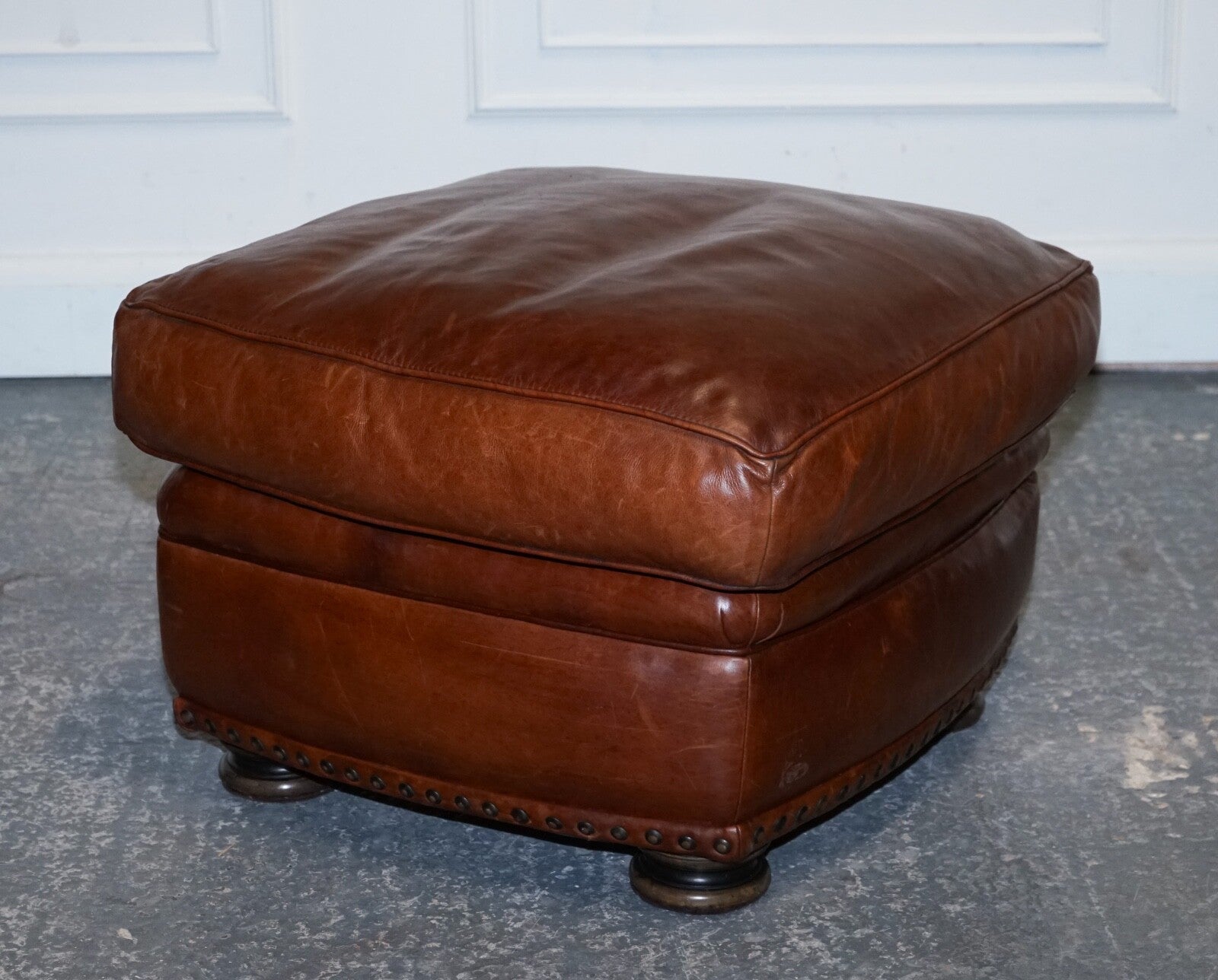 LOVELY VINTAGE BROWN LEATHER FOOTSTOOL FEATHER FILLED BRASS STUDS DETAIL