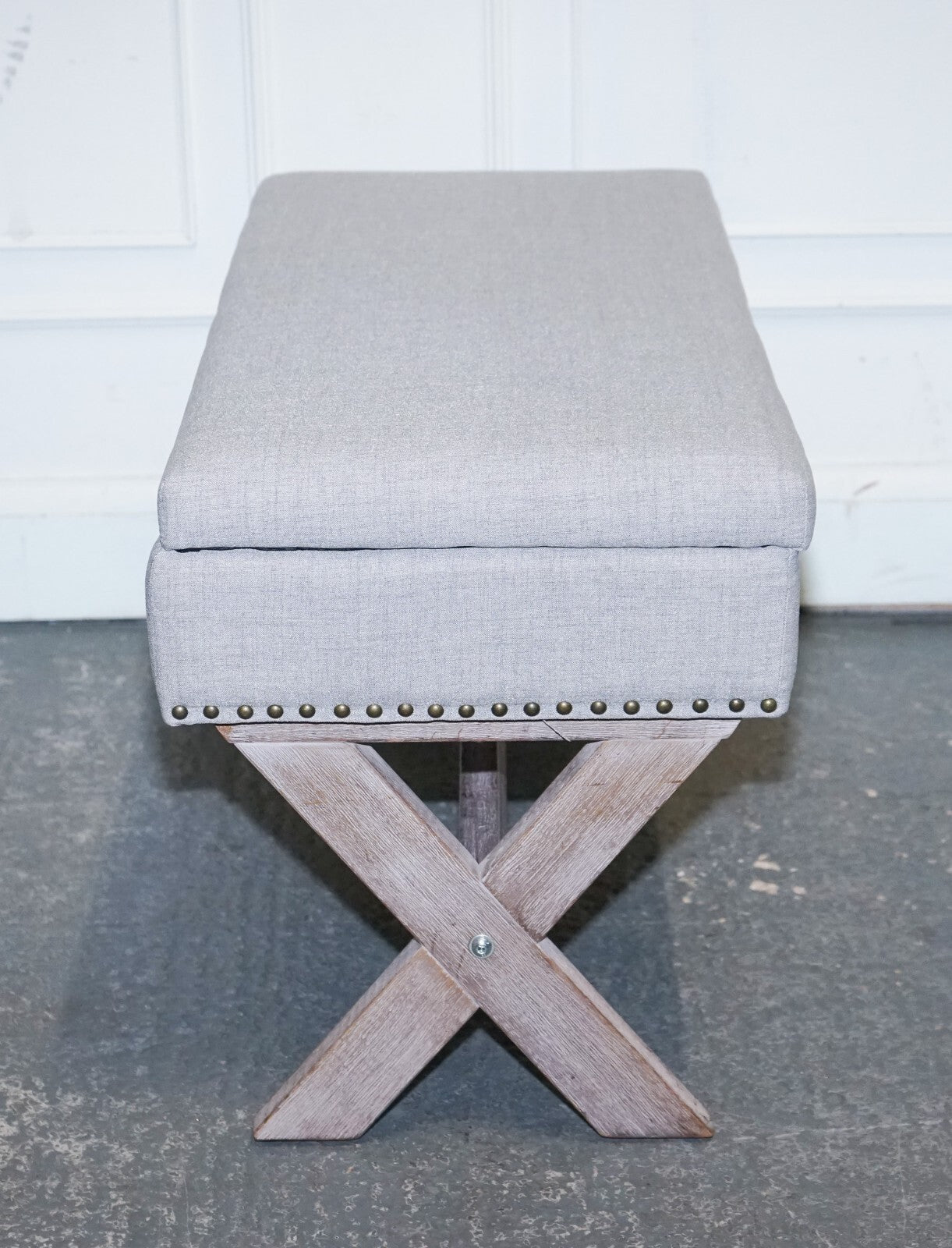 LOVELY VINTAGE GREY TAUPE FABRIC OTTOMAN WITH STORAGE SPACE RAISED ON X FRAME