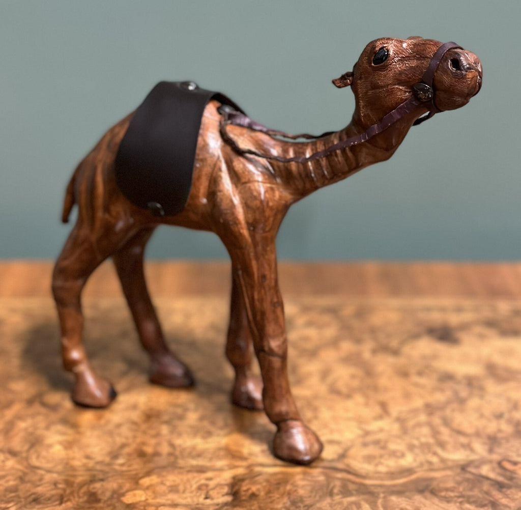 CAMEL SCULPTURE WITH LOVELY AGED LEATHER ON HAND CARVED WOOD BY LIBERTYS LONDON