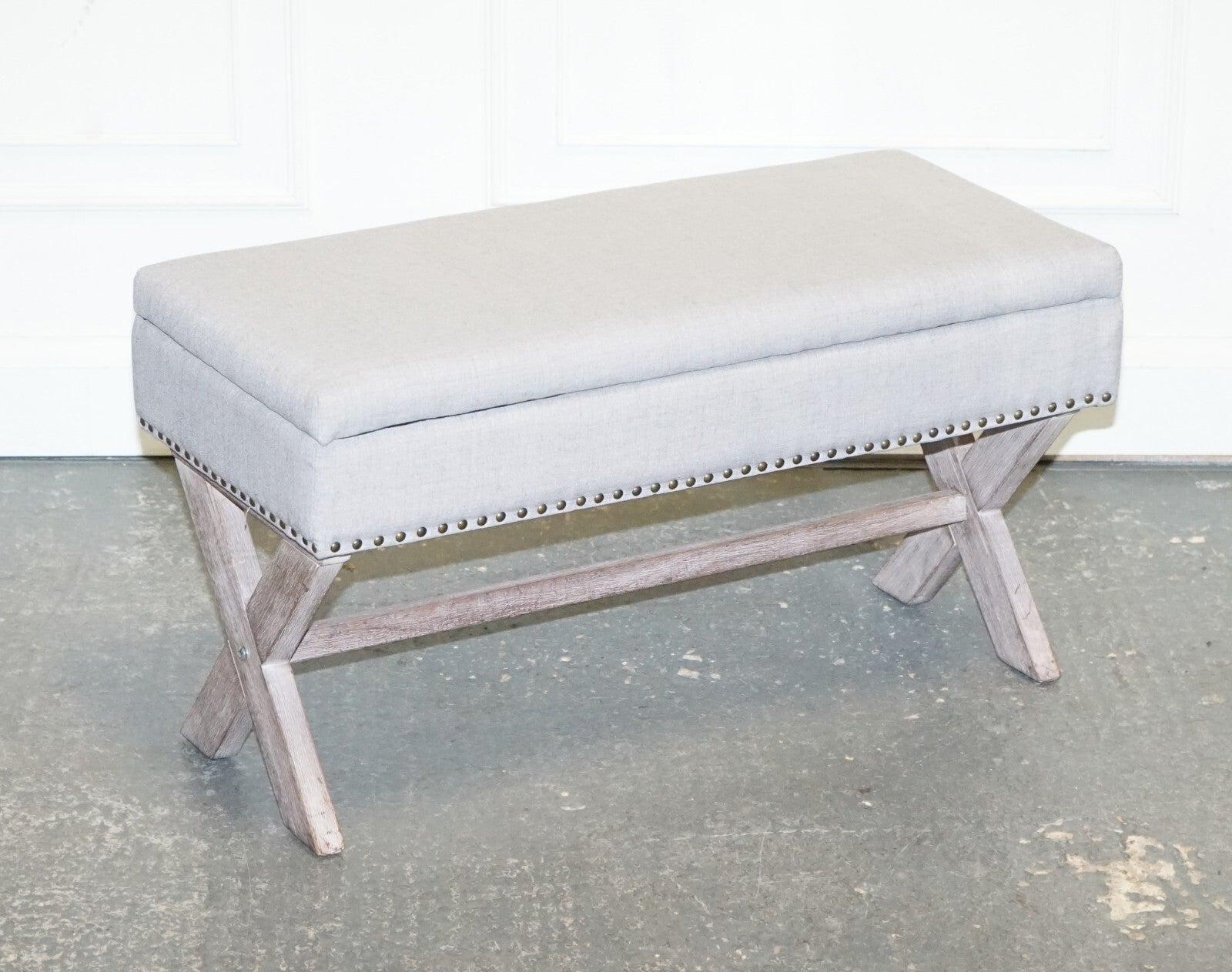 LOVELY VINTAGE GREY TAUPE FABRIC OTTOMAN WITH STORAGE SPACE RAISED ON X FRAME